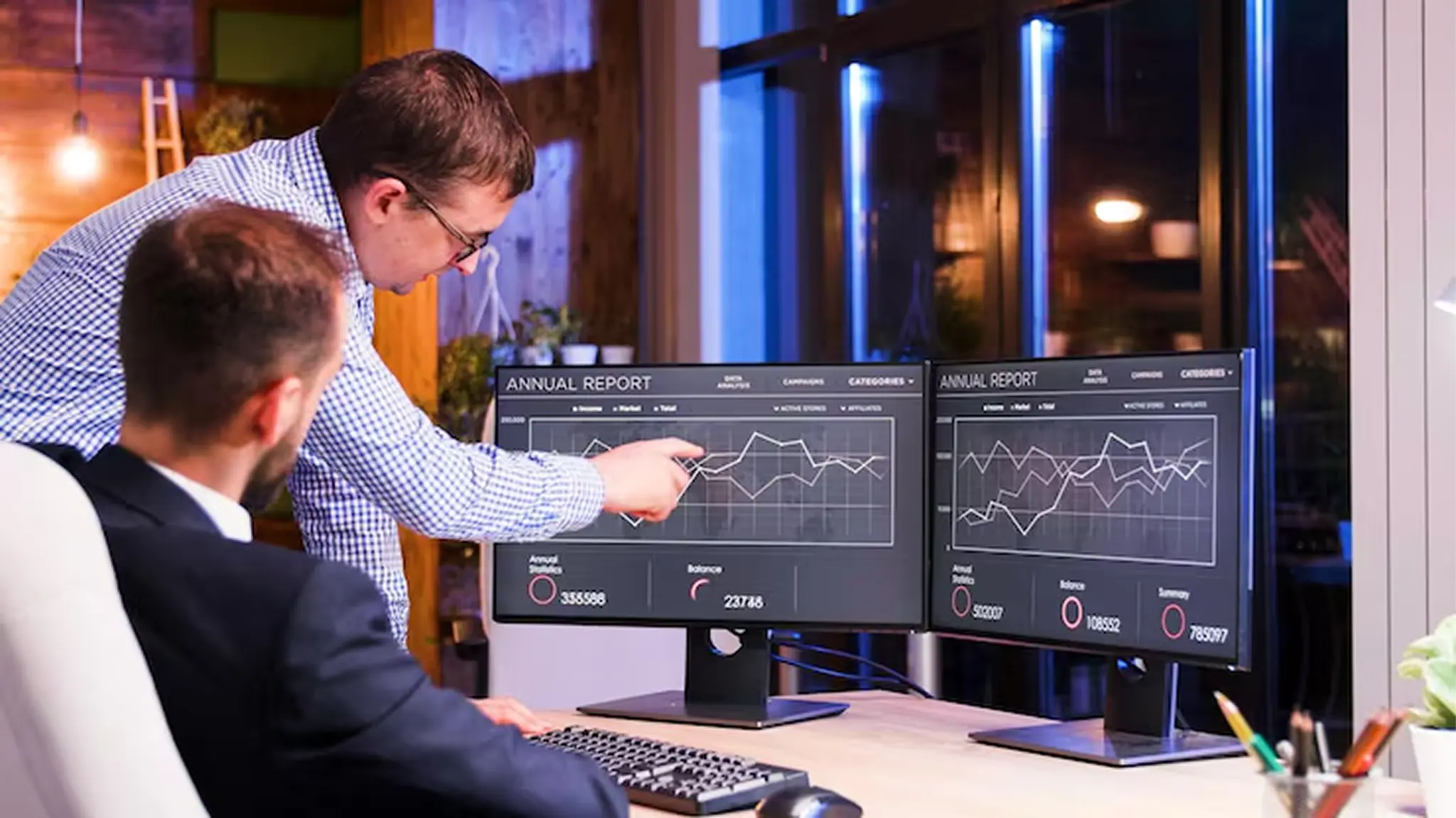 Engineers monitoring website performance on a live dashboard